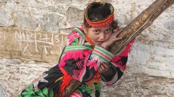 A Kalash girl poses for the camera. Alamgir Khan]