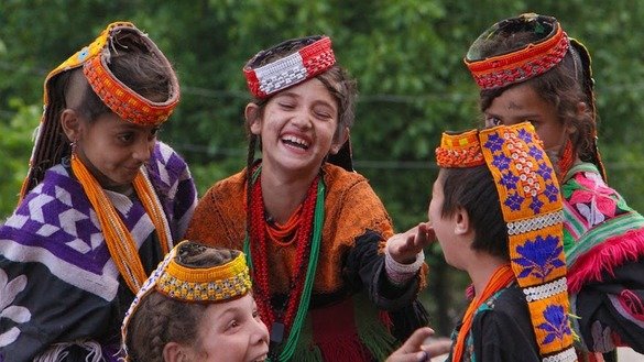Kalash girls are shown playing. [Alamgir Khan]