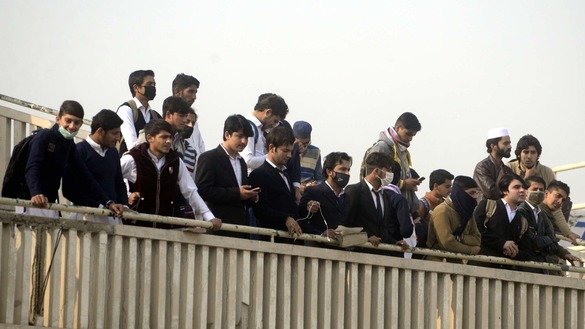 Spectators watch a cricket match in Peshawar December 5. [Shahbaz Butt]