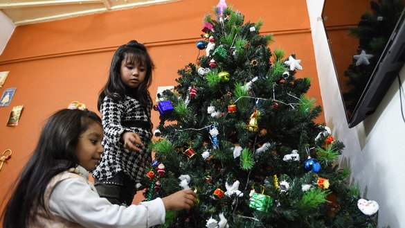 Pakistani children decorate a Christmas tree at their house in Quetta December 20. [Banaras Khan/AFP]