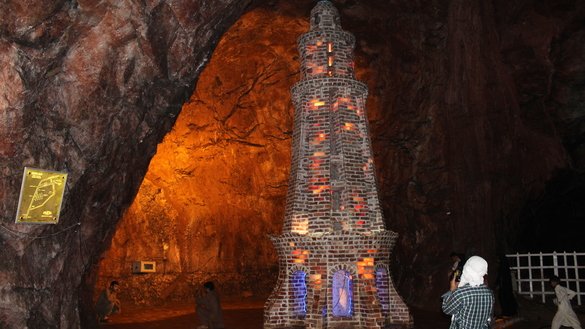 Visitors inside the Khewra Salt Mine photograph a replica of Minar-e-Pakistan on July 7. [Syed Abdul Basit]