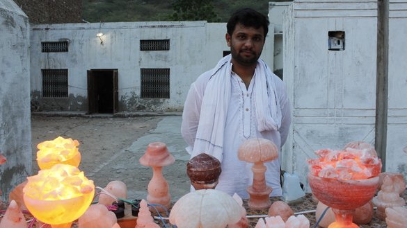 A roadside vendor sells Himalayan salt lamps outside the Khewra Salt Mine on July 7. [Syed Abdul Basit]