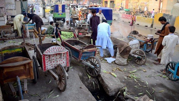 Street vendors sell roasted corn in Peshawar October 31. [Adeel Saeed]