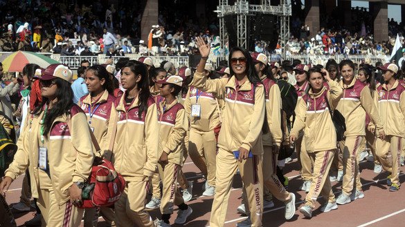 Female athletes wave as they enter Peshawar Sports Complex November 10. [Shahbaz Butt]