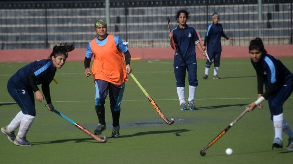 Female field hockey teams compete in Peshawar November 10. [Shahbaz Butt]