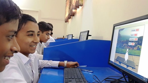 Sixth-grade students at Government High School Sufaid Dheri work on a game on November 14. [Danish Yousafzai]
