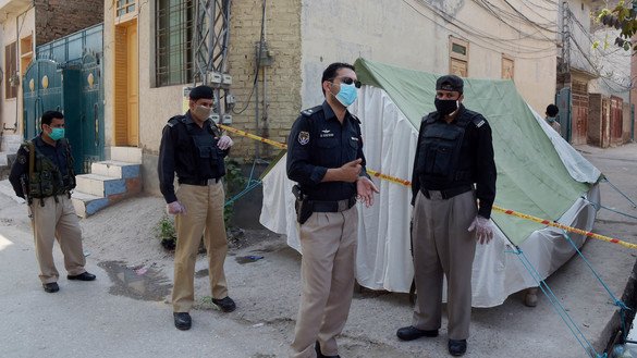 Police March 22 set up a tent outside the house of someone suspected of having coronavirus in Peshawar. [Shahbaz Butt]
