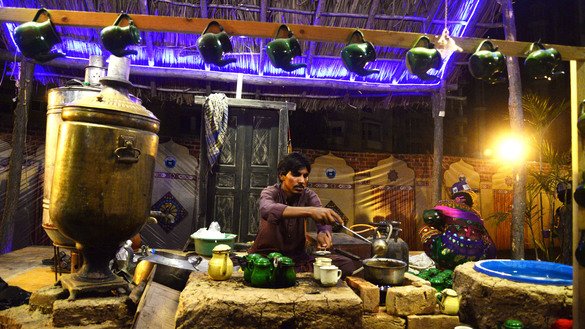 A vendor prepares tea at the Hunar Mela May 9. [Shahbaz Butt]