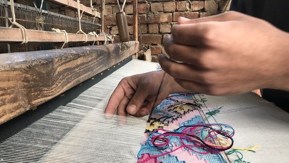 Local male and female artisans design creative patterns on shawls. Sometimes they spend weeks on a single shawl. [Danish Yousafzai]