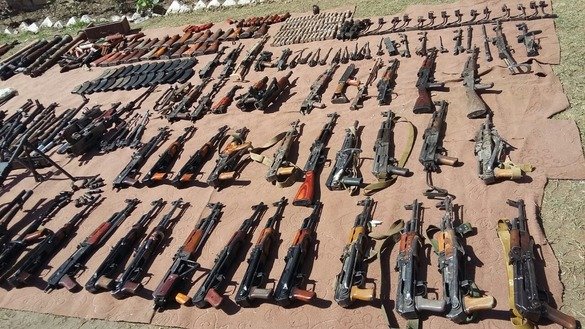 Security forces present a number of AK-47's captured in Kurram Agency April 10. [ISPR]