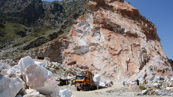 Workers load a truck with marble in May in Mohmand Agency. [Alamgir Khan]