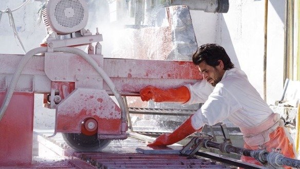A factory worker processes marble in May in Mohmand Agency. [Alamgir Khan]