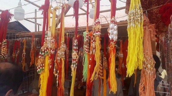 A vendor at the Shri Swaminarayan Mandir in Karachi sells rakhis August 22. [Zia Ur Rehman]