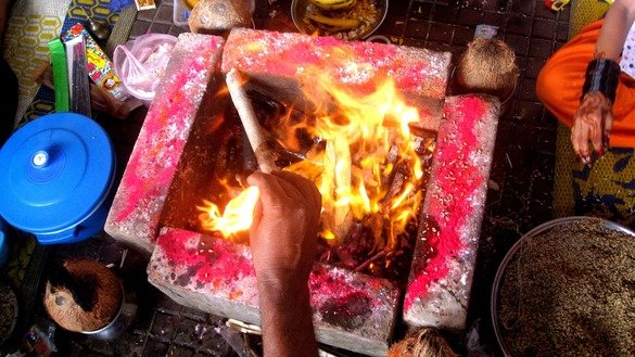 A Hindu performs a fire ritual August 26 at Shri Swaminarayan Mandir in Karachi for Raksha Bandhan. [Zia Ur Rehman]