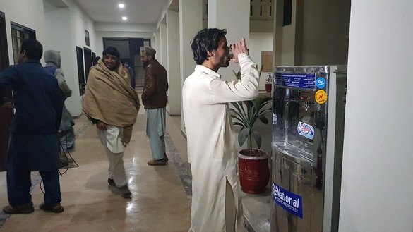 Jameel Khan, 27, drinks water at one of the shelter homes in Peshawar, Khyber Pakhtunkhwa, December 15. [Danish Yousafzai]