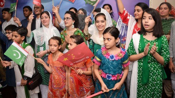 Girls August 10 in Peshawar sing patriotic songs at an event held in connection with Independence Day. [Shahbaz Butt]