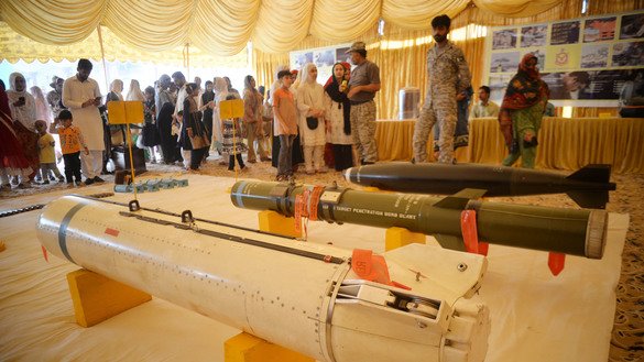 Visitors look at different kinds of missiles during a Defence and Martyrs Day exhibition in Peshawar on September 6. [Shahbaz Butt]