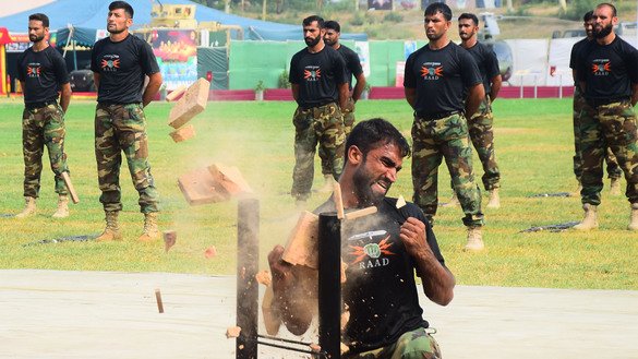 Army personnel demonstrate martial arts skills during an exhibition in Peshawar on September 6. [Shahbaz Butt]