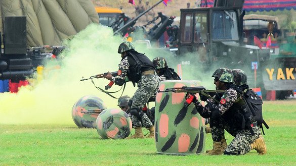 Army personnel simulate a battle during an exhibition for Defence and Martyrs Day September 6. [Shahbaz Butt]