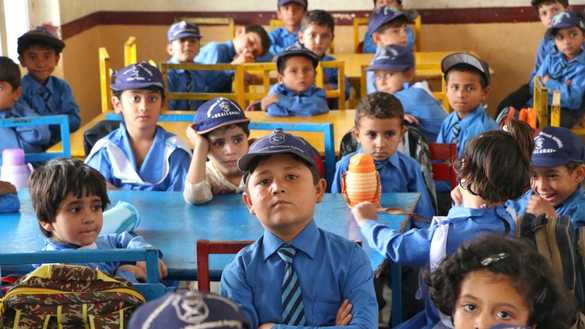 Students attend a class at the Mohmand Model School in Ghazi Baig, Mohmand District, on December 5. [Alamgir Khan]