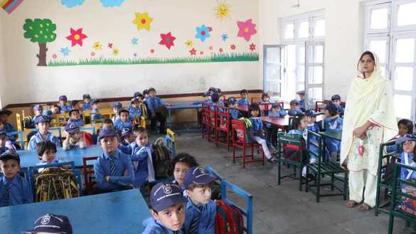 Students attend a class at the Mohmand Model School in Ghazi Baig, Mohmand District, on December 5. [Alamgir Khan]