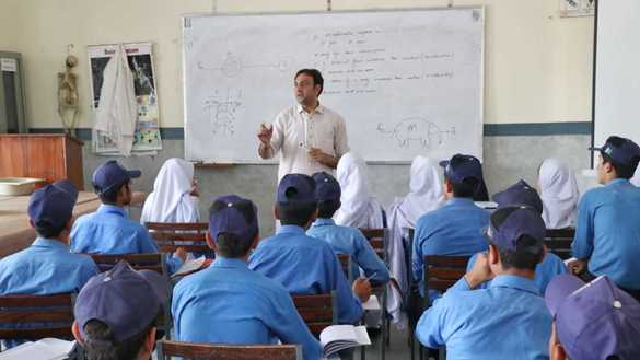 A teacher leads his class on December 5 at the Mohmand Model School. [Alamgir Khan]
