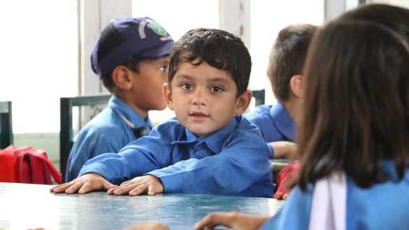 Students at the Mohmand Model School attend class on December 5. [Alamgir Khan]