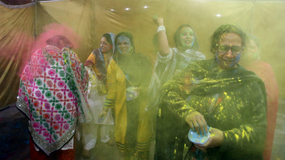 Women celebrate Holi in Peshawar on March 10. [Shahbaz Butt]