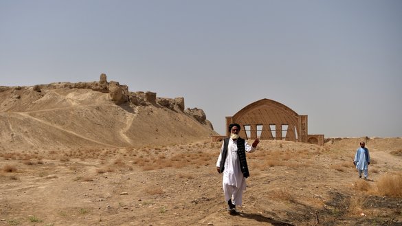Men walk at the historic fortress of Qala-e-Bost on the outskirts of Lashkargah, Helmand province, on March 27. [Wakil Kohsar/AFP]